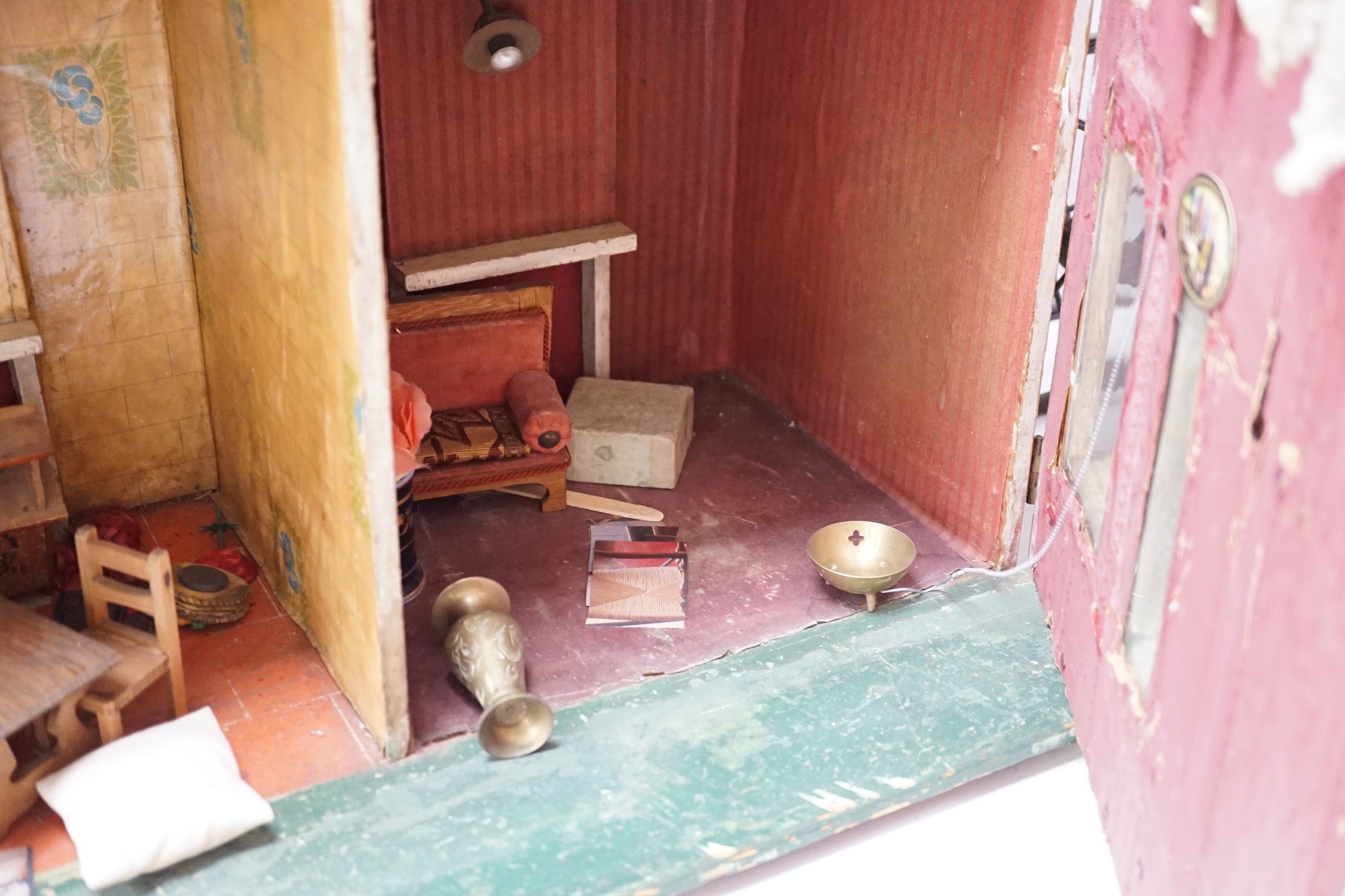 ‘Heiress House’: A commercially made London ‘boxback’ dolls’ house, late 19th century, 56cms wide x 68cms high